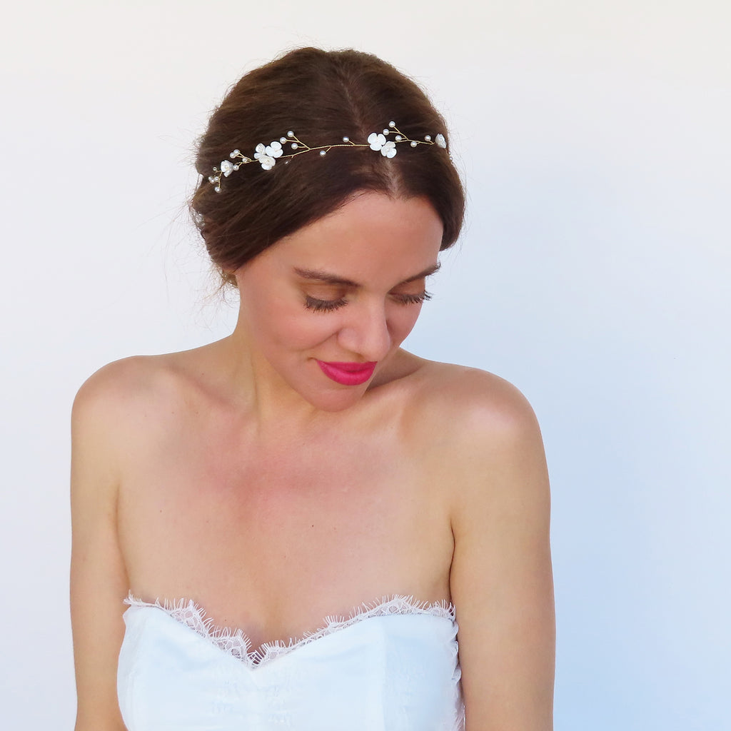 dainty wedding hair piece in gold with white accents